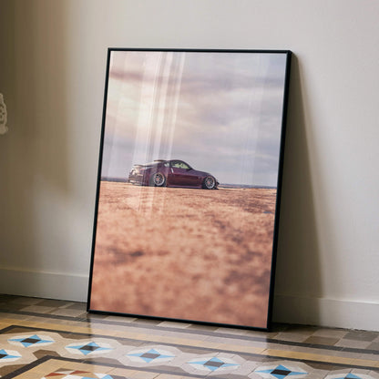 Nissan 350z poster with purple car on desert landscape, modern automotive wall art in black frame.