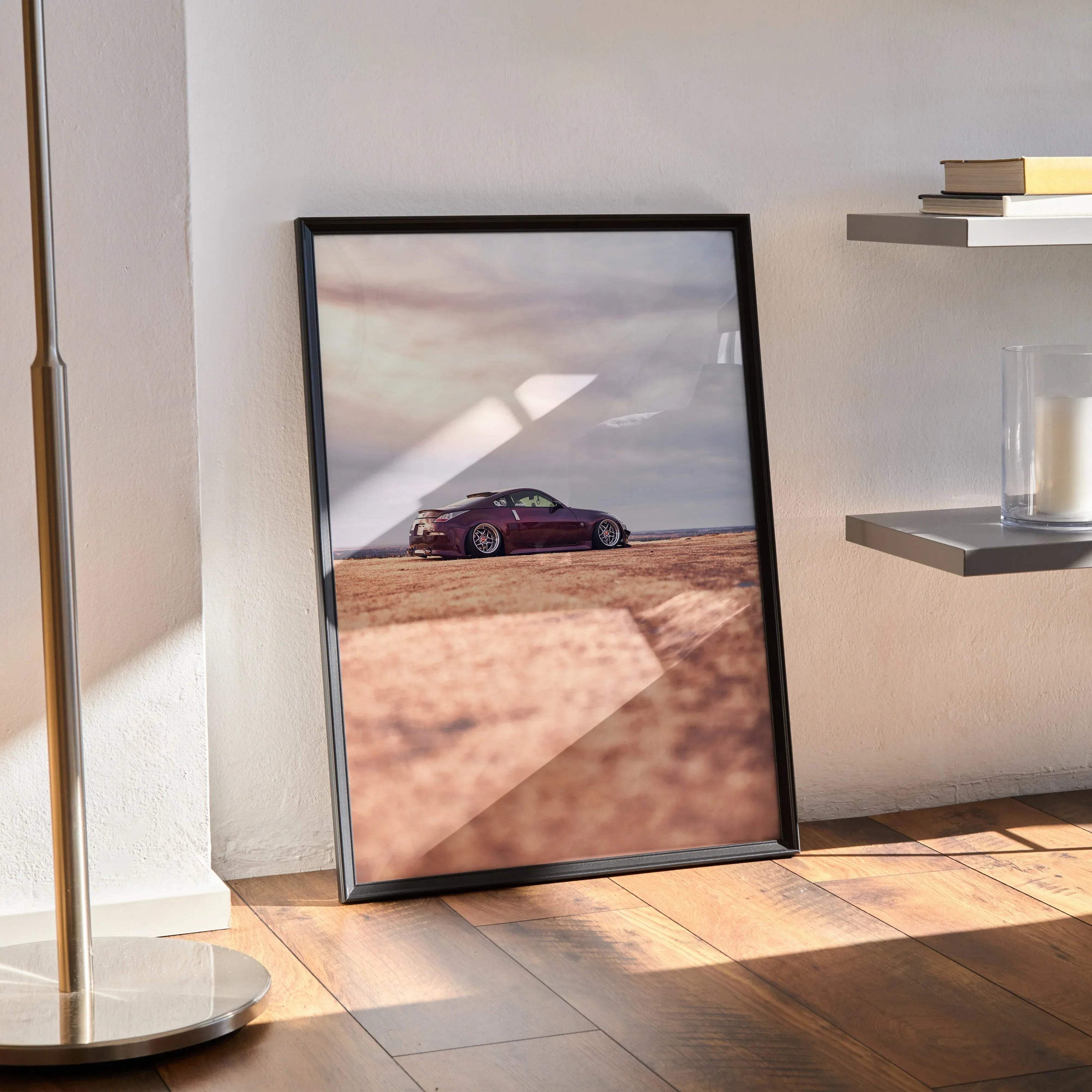 Nissan 350z poster featuring sleek purple sports car on desert road wall art with black frame.