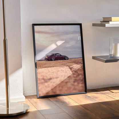 Nissan 350z poster featuring sleek purple sports car on desert road wall art with black frame.