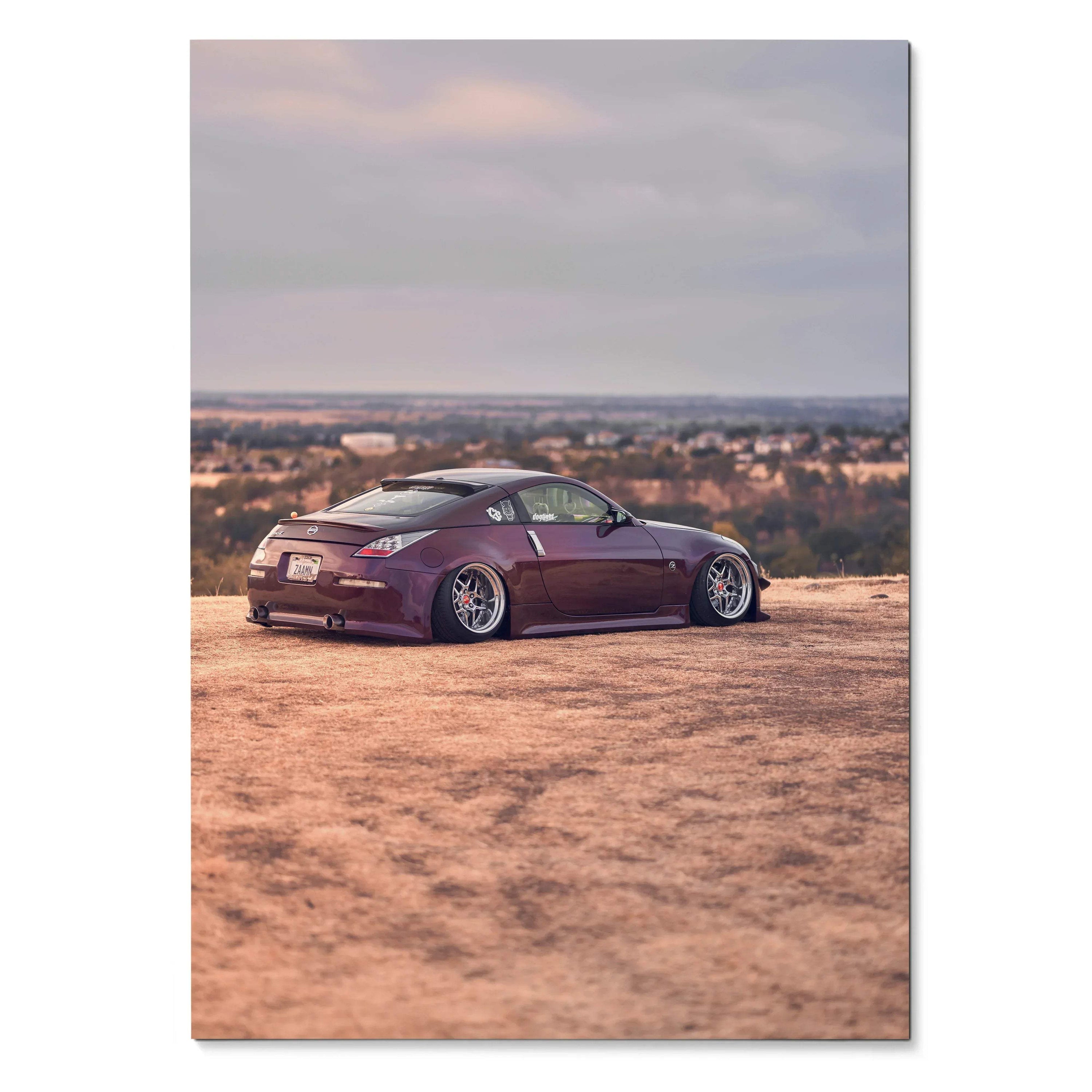 Purple Nissan 350z lowered on dirt ground with cityscape background poster wall art.