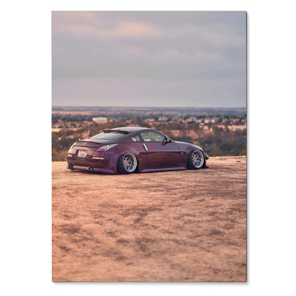 Purple Nissan 350z lowered on dirt ground with cityscape background poster wall art.