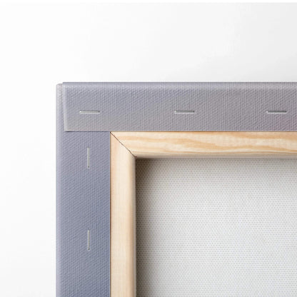 Close-up of wooden frame and grey stapled edge on blank canvas art for wall decor.