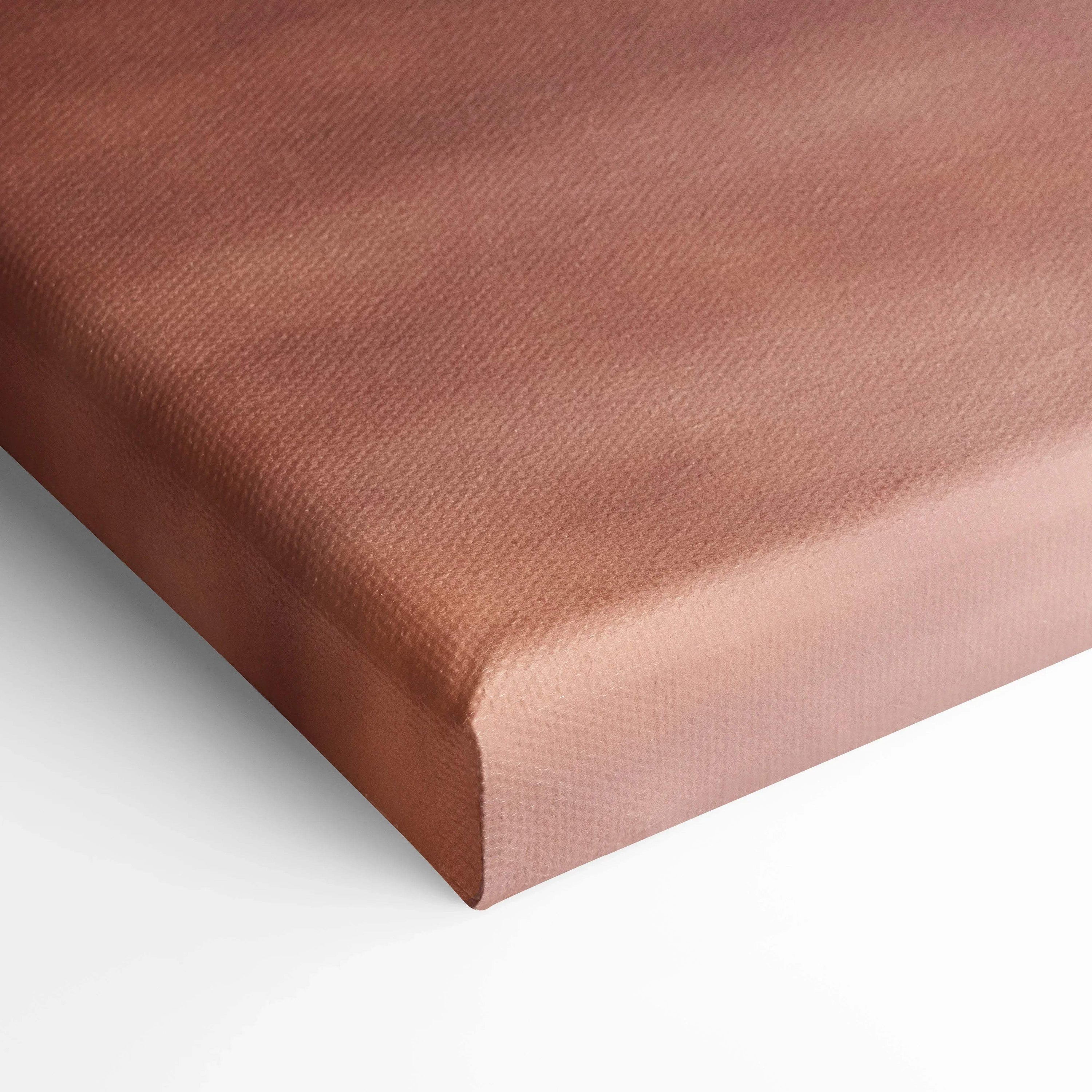 Close-up of brown textured canvas wrap with tight corner fold, showcasing museum-quality canvas art texture for wall art.