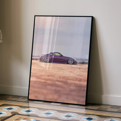 Nissan 350z poster with purple sports car on desert road, sleek wall art in black frame.