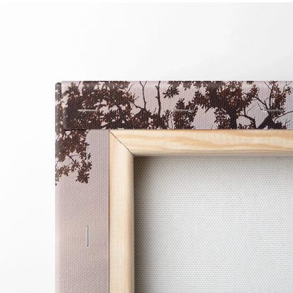 Close-up of wooden frame and textured canvas edge with dark tree silhouette, vertical wall art detail.