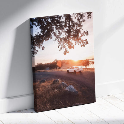 Vertical canvas wall art featuring a white Nissan R33 GTS-T at sunset under tree branches.