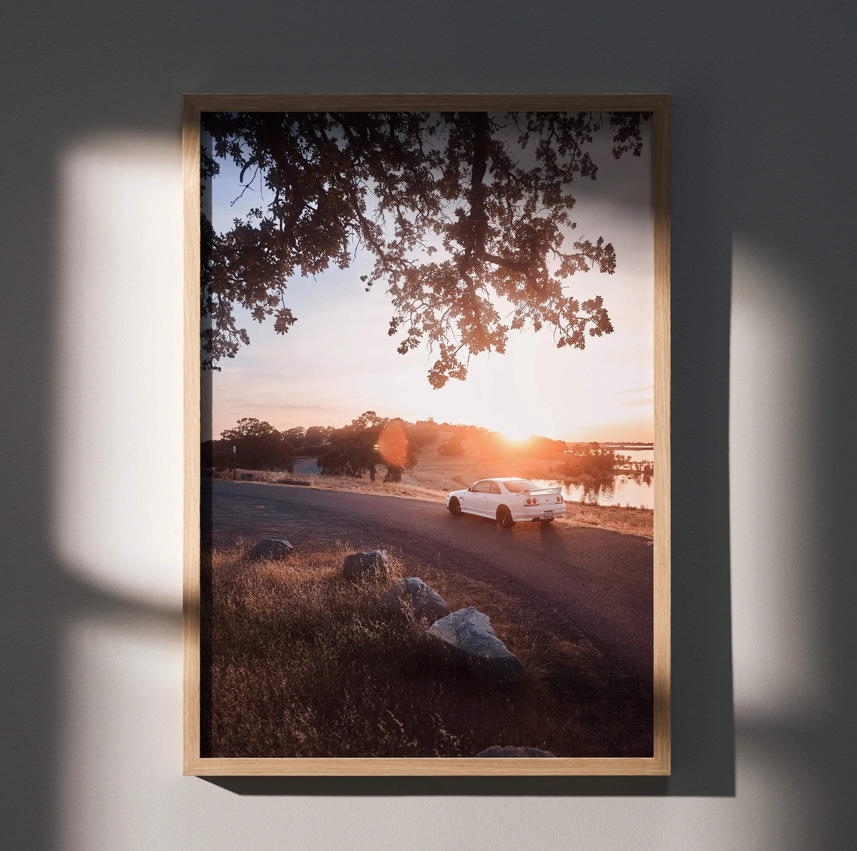 Nissan Skyline R33 GTS-T poster wall art showcasing sunset drive with warm tones and scenic landscape.