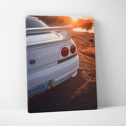 White Nissan R33 GTS-T rear view at sunset on vertical canvas wall art.