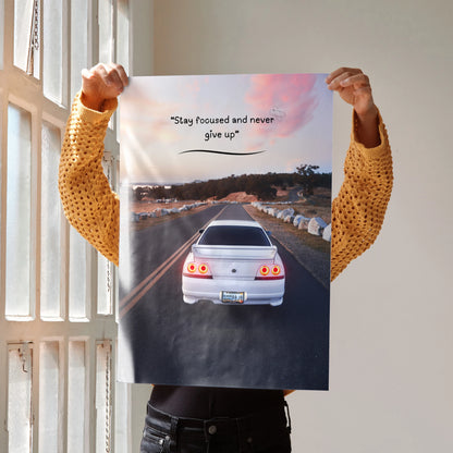Motivational poster wall art featuring Nissan R33 Skyline GTS-T on road with inspiring text.