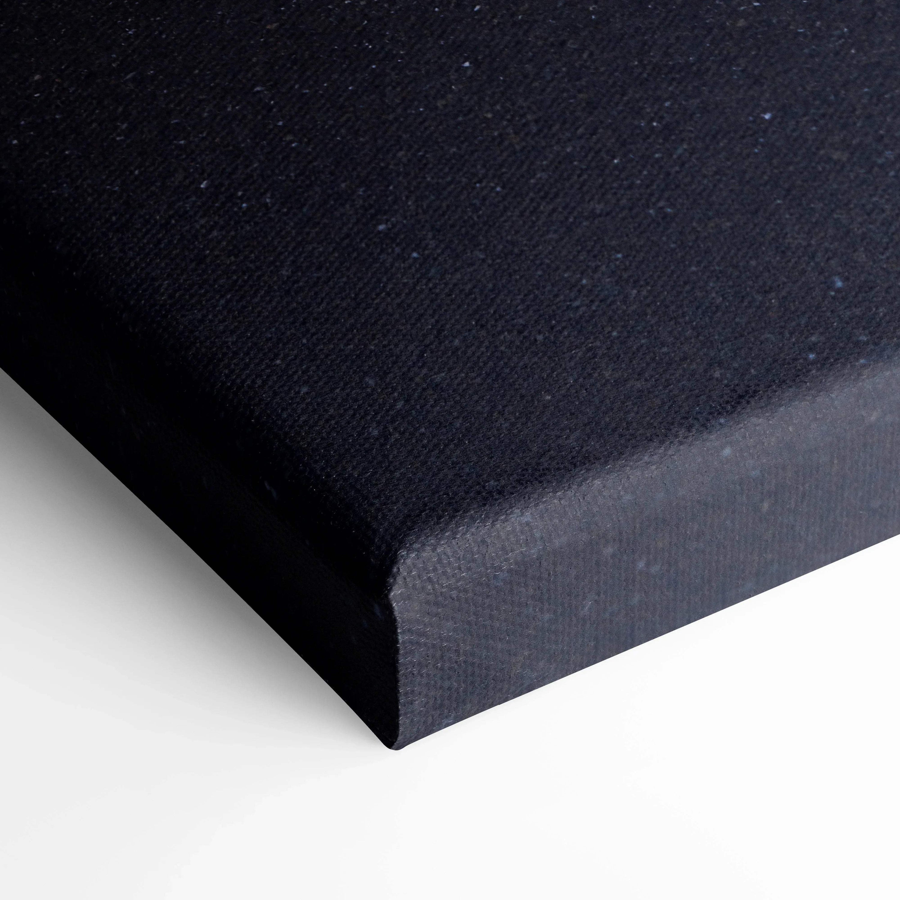 Black wrapped canvas corner with textured fabric and clean edges for wall art display.