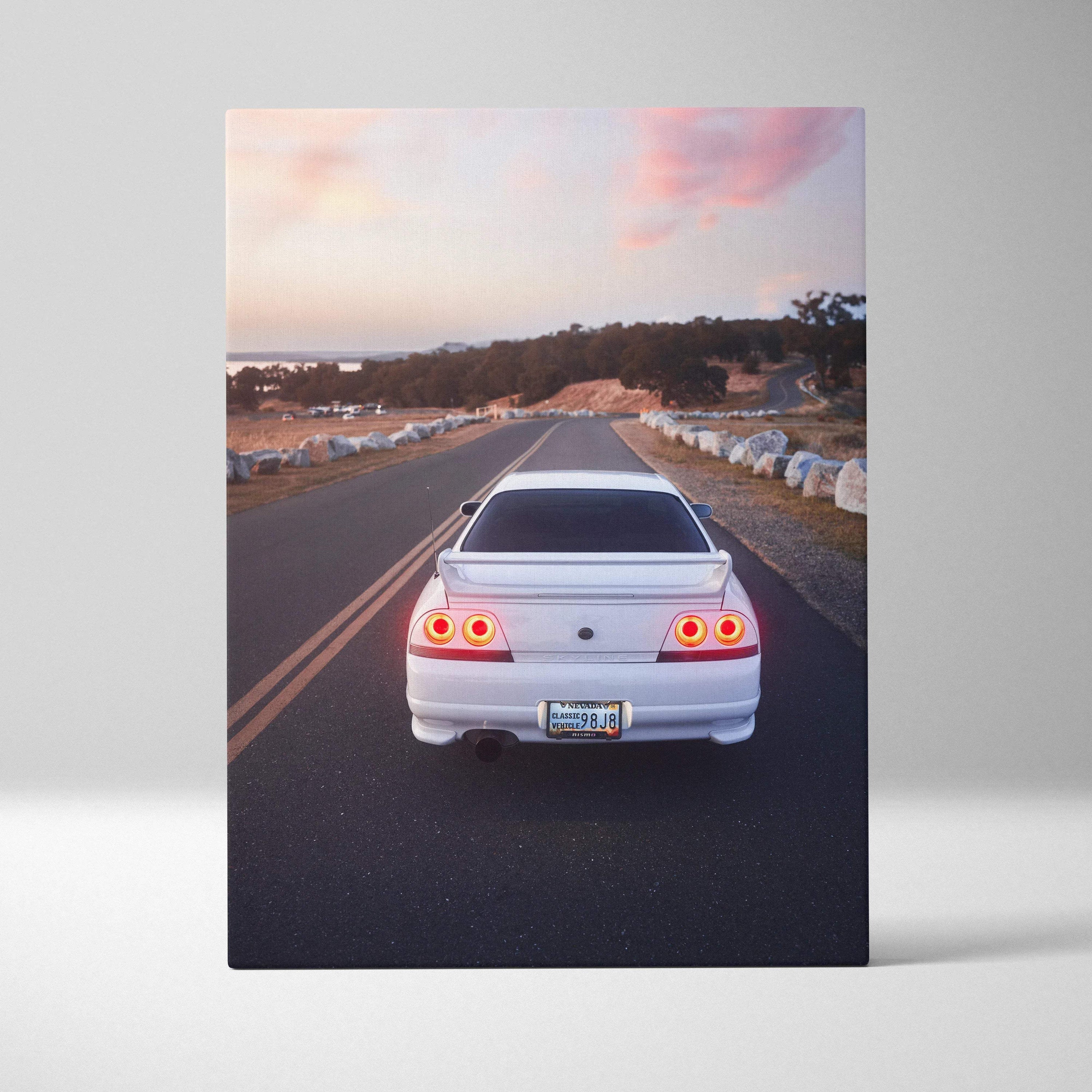 Nissan R33 GTS-T rear view driving on road at sunset canvas wall art print.