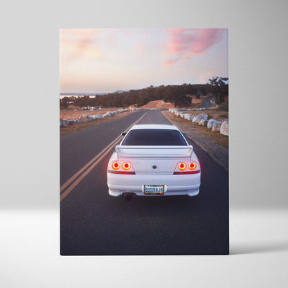 Nissan R33 GTS-T rear view driving on road at sunset canvas wall art print.
