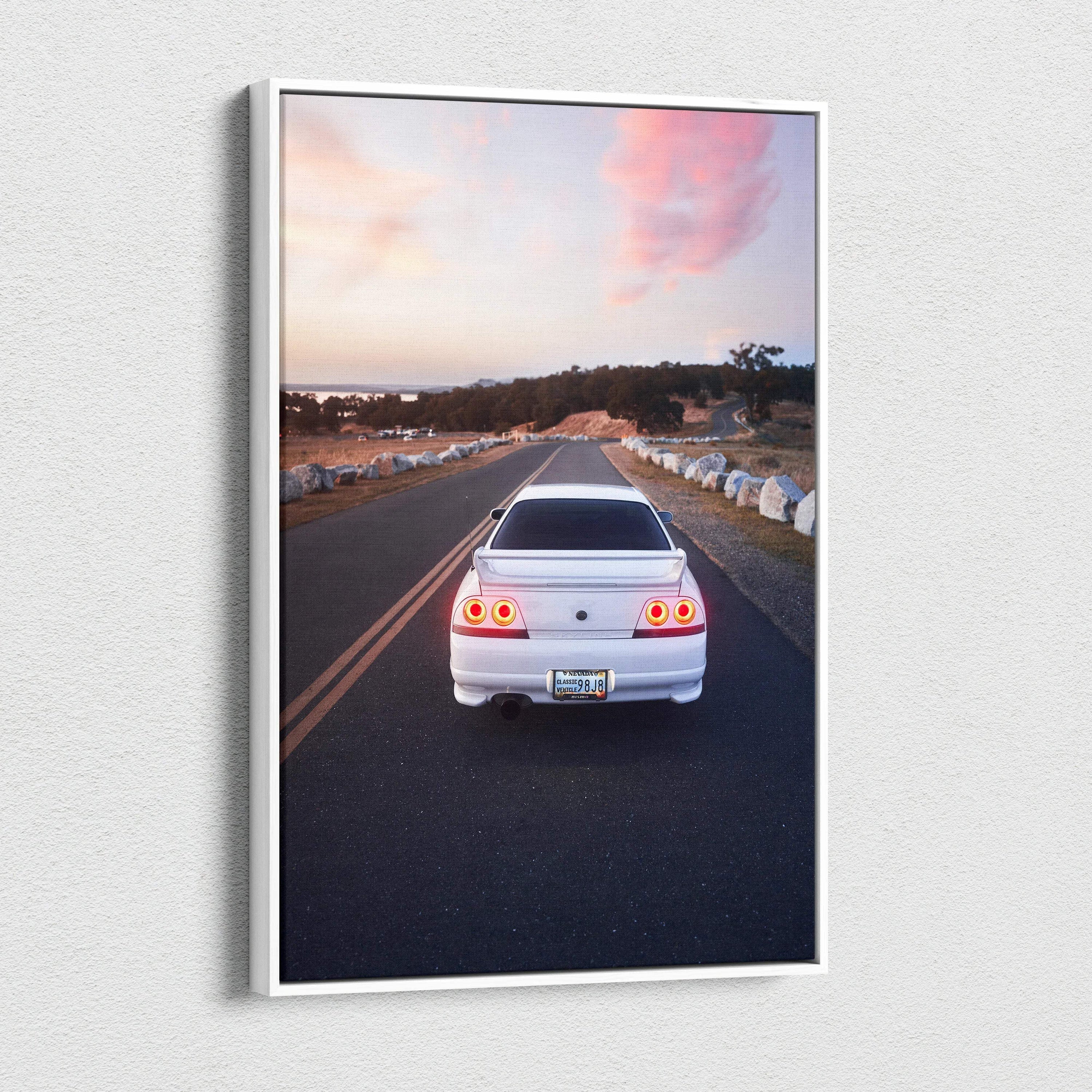 White Nissan R33 GTS-T on road at sunset with vibrant sky vertical canvas wall art.