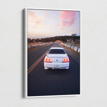 White Nissan R33 GTS-T on road at sunset with vibrant sky vertical canvas wall art.