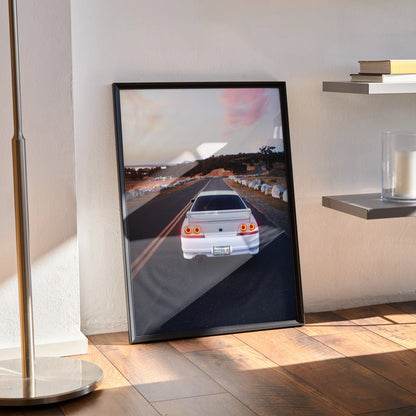 Nissan Skyline R33 GTS-T rear view poster in black frame leaning against wall, automotive wall art.