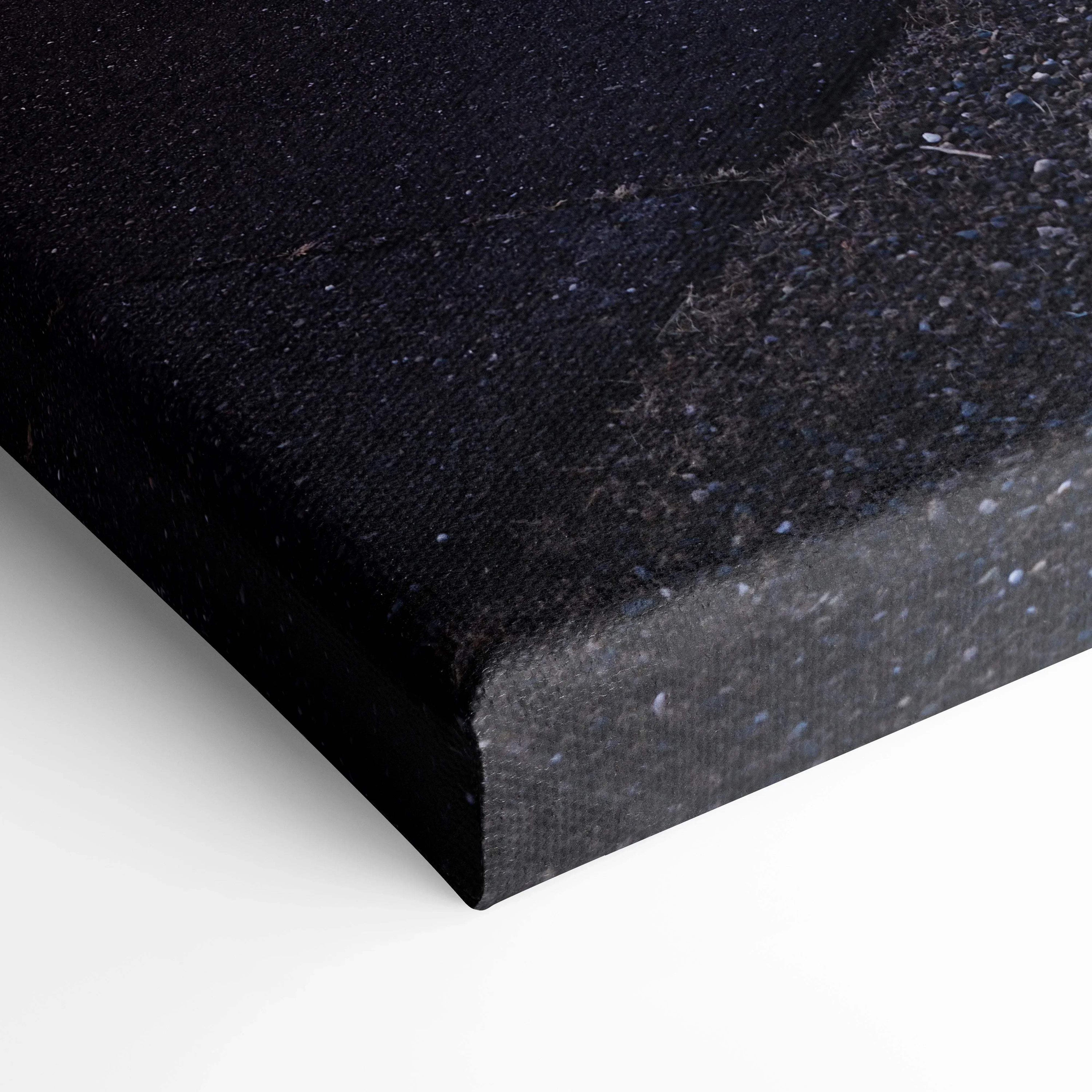 Close-up of black textured canvas corner showing high-quality wall art print edge.