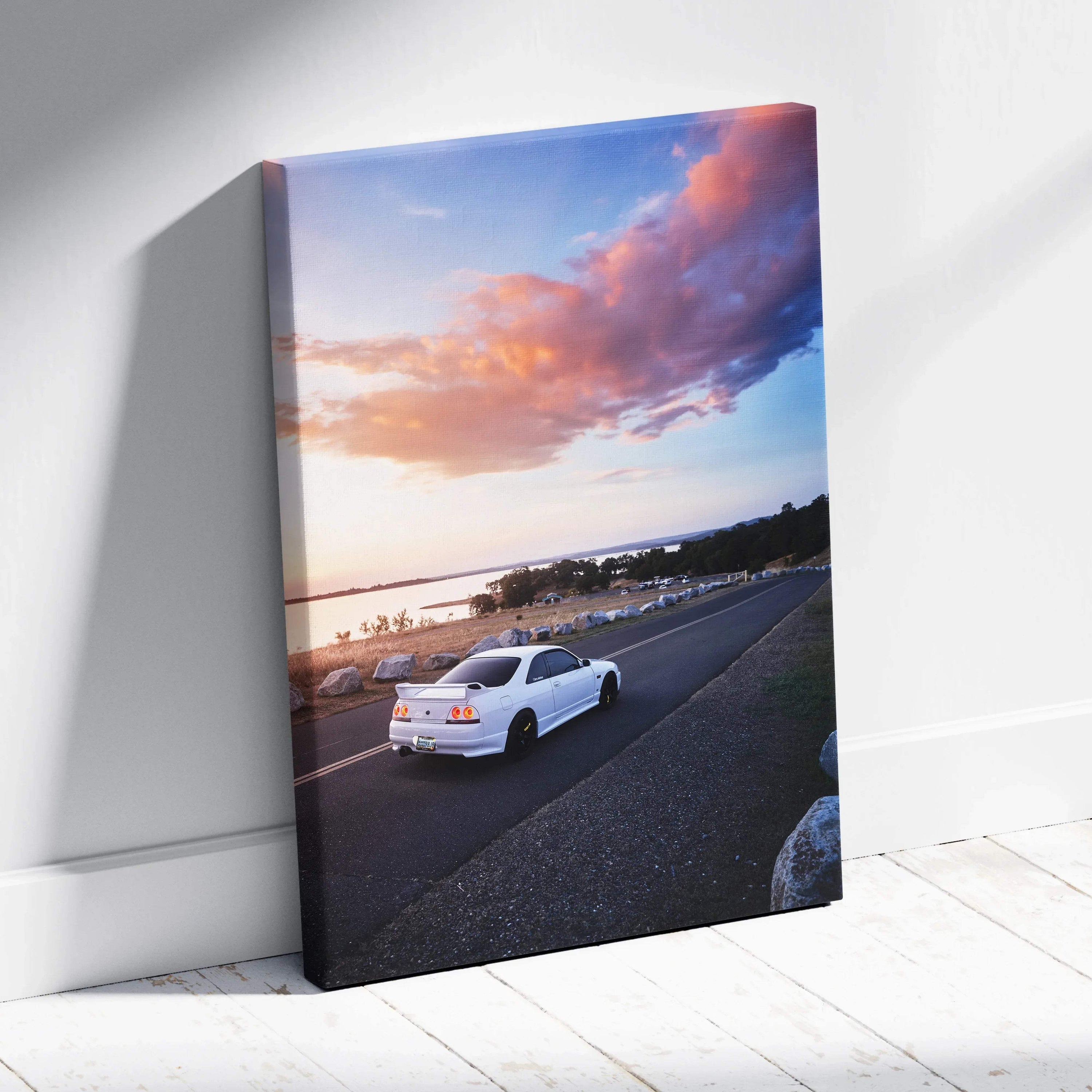 Nissan R33 GTS-T on road at sunset canvas wall art with vibrant sky and detailed car design.