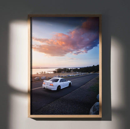 Nissan R33 GTS-T white car driving at sunset poster wall art in wooden frame.