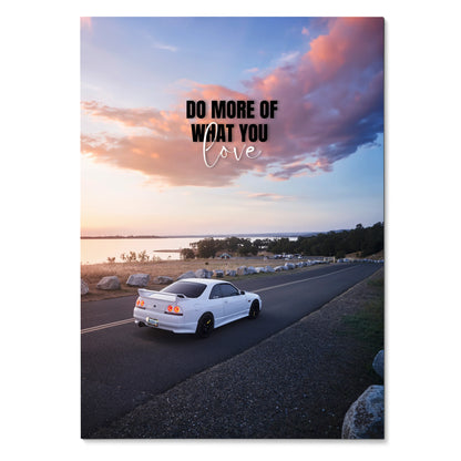 Motivational poster wall art with white Nissan R33 Skyline GTS-T driving on coastal road at sunset.