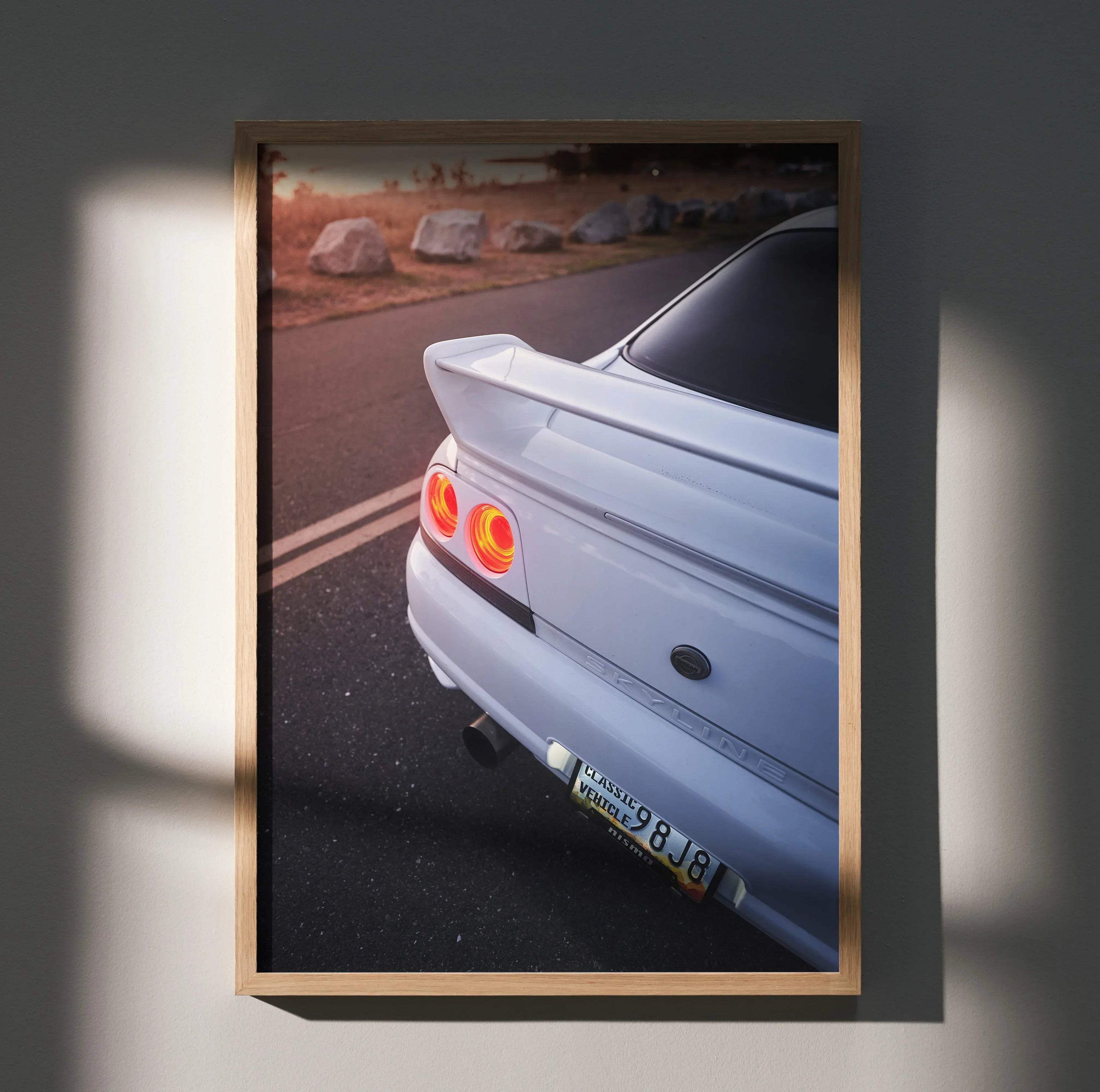 Nissan Skyline R33 GTS-T rear view with taillights lit poster wall art in wooden frame.