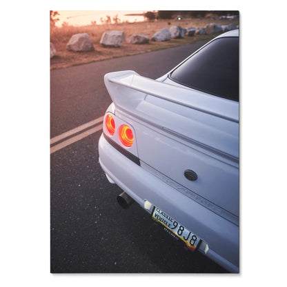 Nissan Skyline R33 GTS-T rear view with taillights glowing at sunset poster wall art.