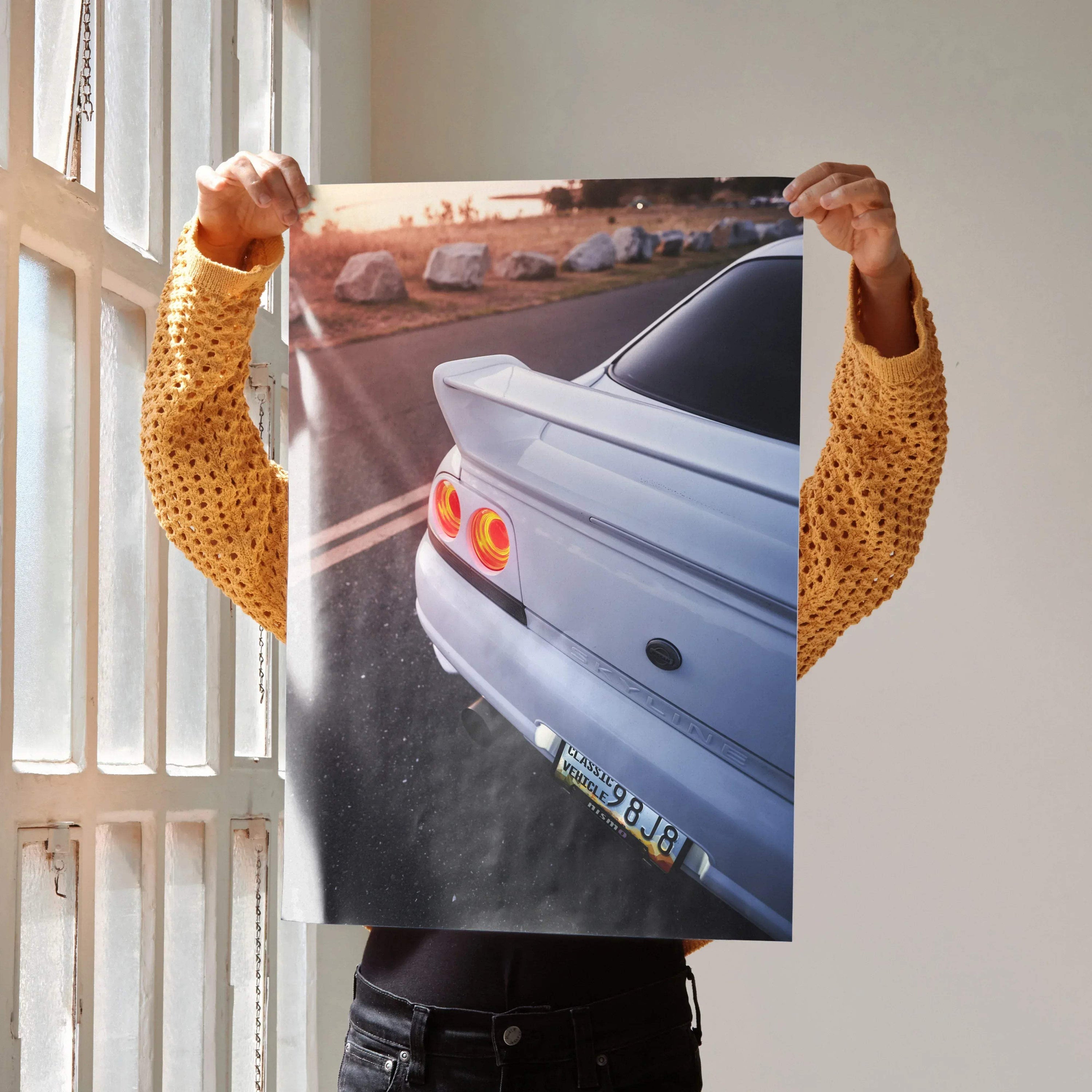 Nissan Skyline R33 GTS-T rear view poster wall art with sunset background and sporty spoiler.