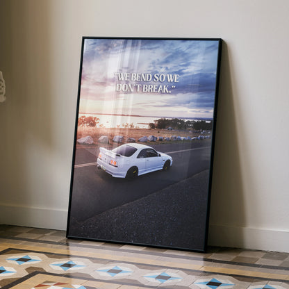 Motivational poster wall art featuring white Nissan R33 Skyline GTS-T with sunset sky and inspiring text.