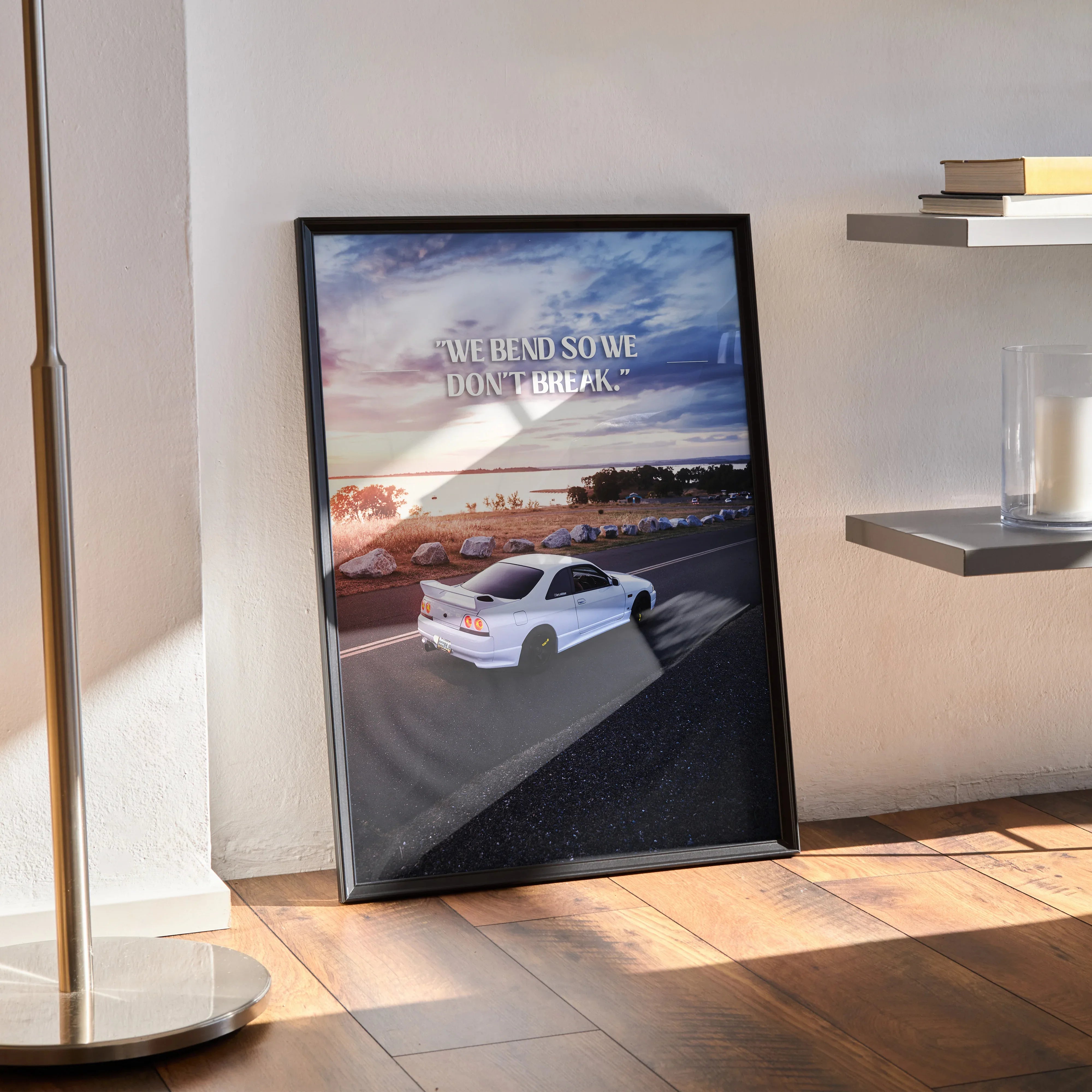 Motivational poster wall art featuring white Nissan R33 Skyline GTS-T on coastal road at sunset.