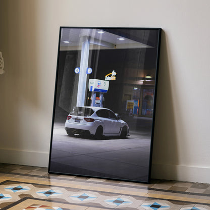 Subaru WRX STI poster wall art featuring a white car at a nighttime gas station.
