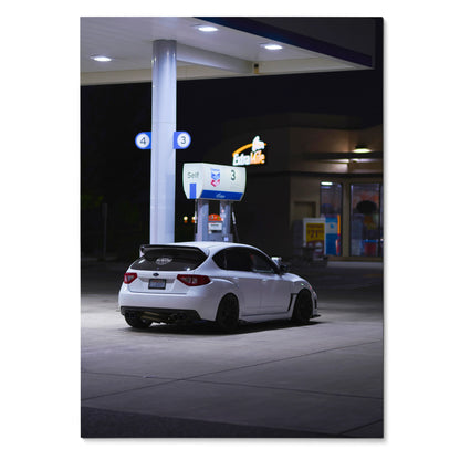 White Subaru WRX STI parked at nighttime gas station poster wall art.