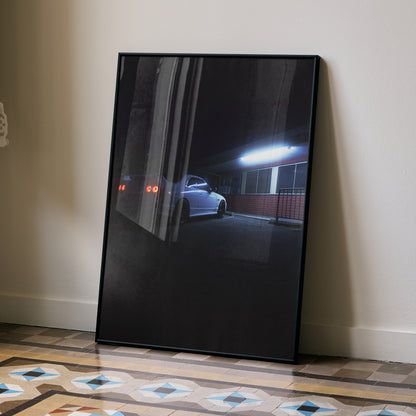 Nissan Skyline R33 GTS-T parked under streetlight at night poster wall art in black frame.