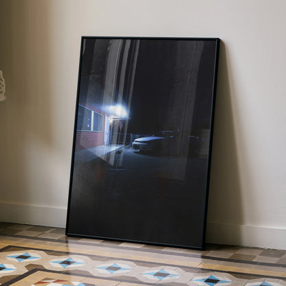 Nissan Skyline R33 GTS-T poster with dark night street scene, leaning black frame wall art.