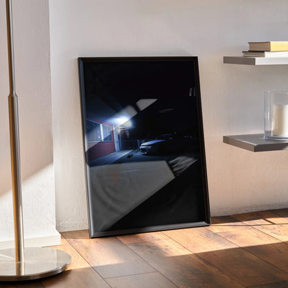 Nissan Skyline R33 GTS-T poster in sleek black frame leaning against wall, automotive wall art with dark, moody tones.