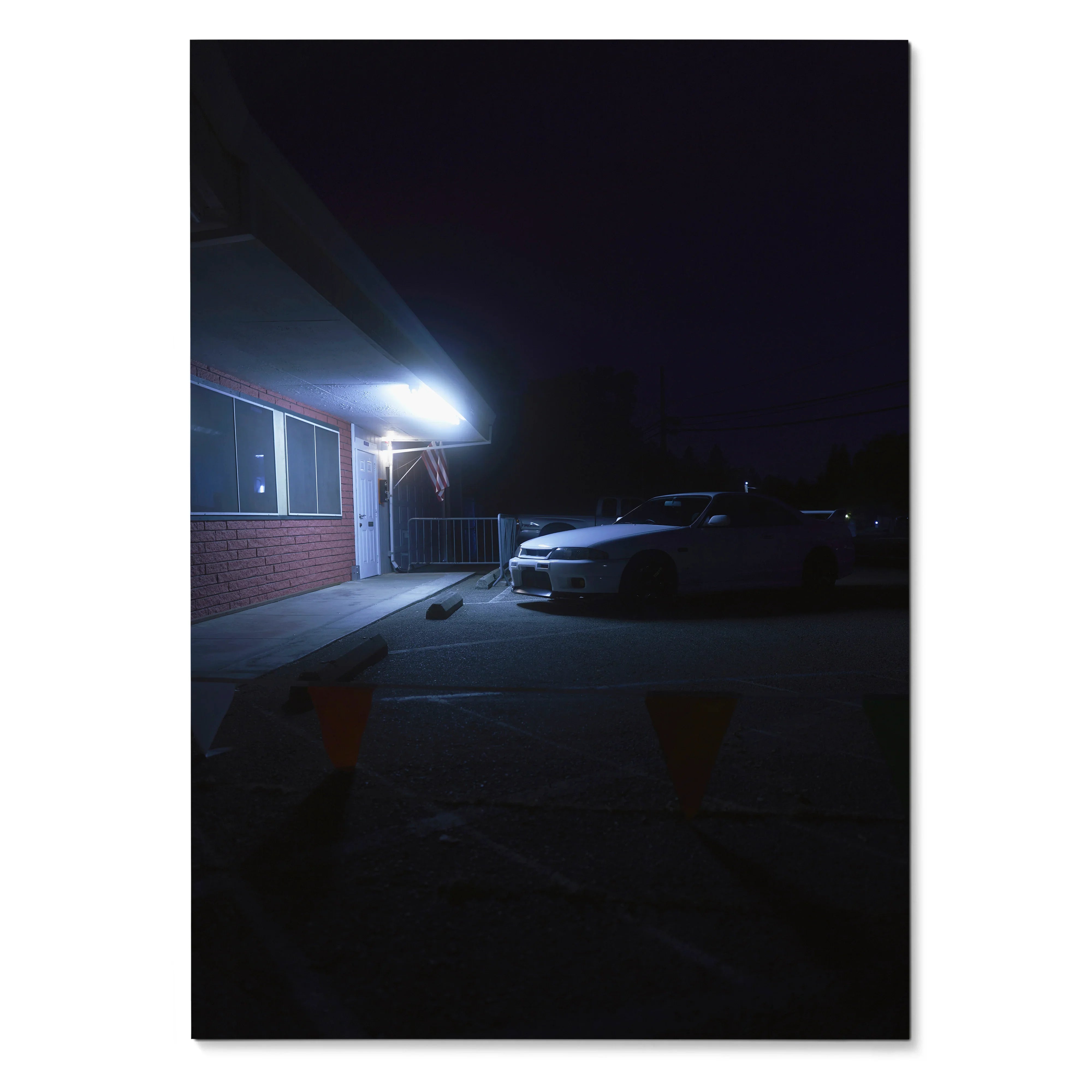 Nissan Skyline R33 GTS-T parked at night under bright wall light poster wall art.
