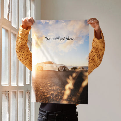 Motivational wall art poster featuring a Nissan 370z on a sunlit road with inspiring text "You will get there.".