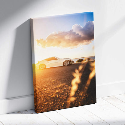 Nissan 370z sunset scene vertical canvas wall art with warm lighting and detailed car silhouette.
