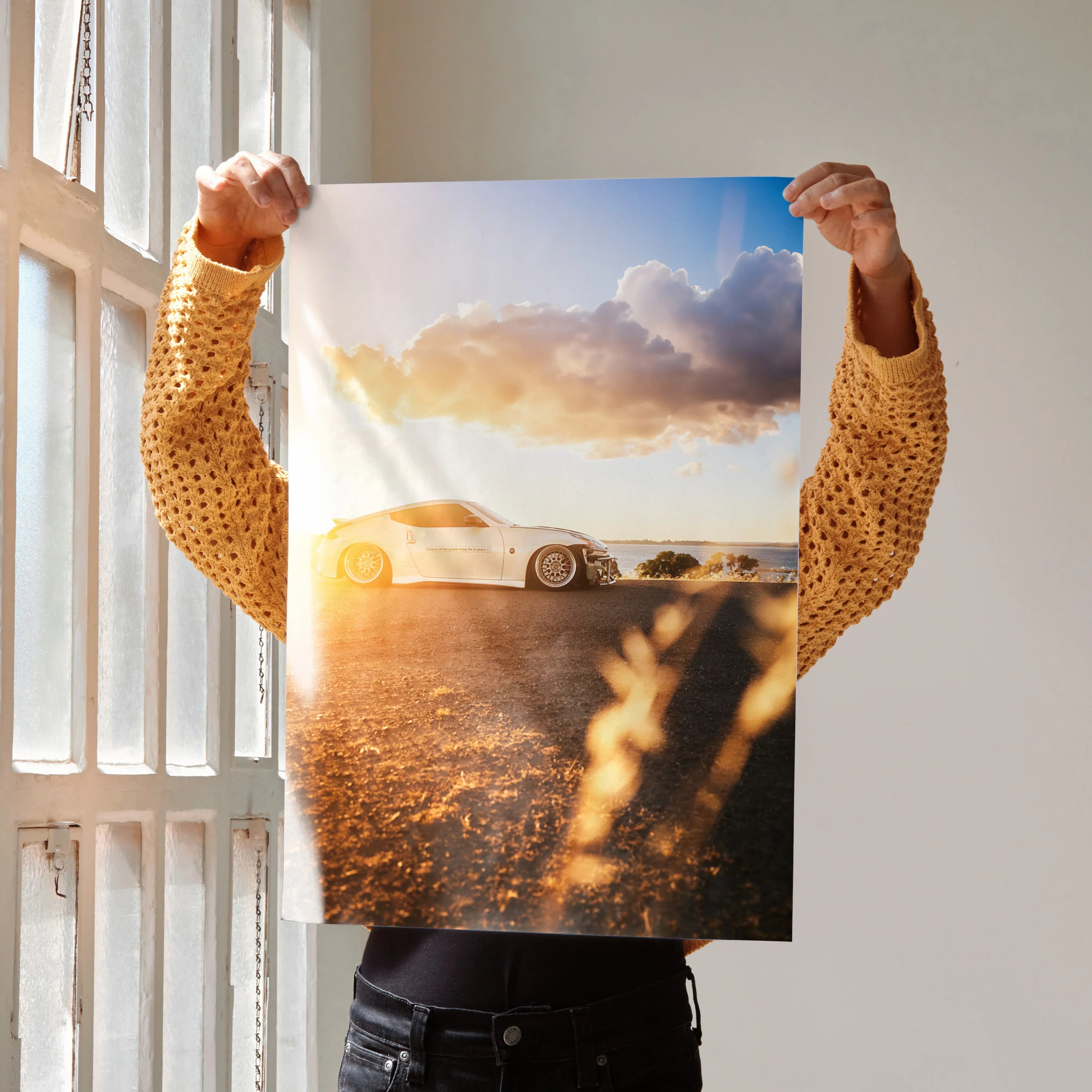 Nissan 370z poster showing car at sunset with warm lighting, wall art for car enthusiasts.