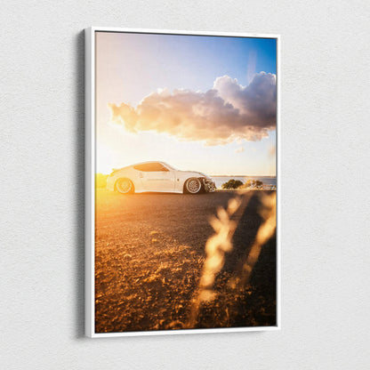 Nissan 370z on desert road at sunset canvas wall art with warm golden light and dramatic sky.
