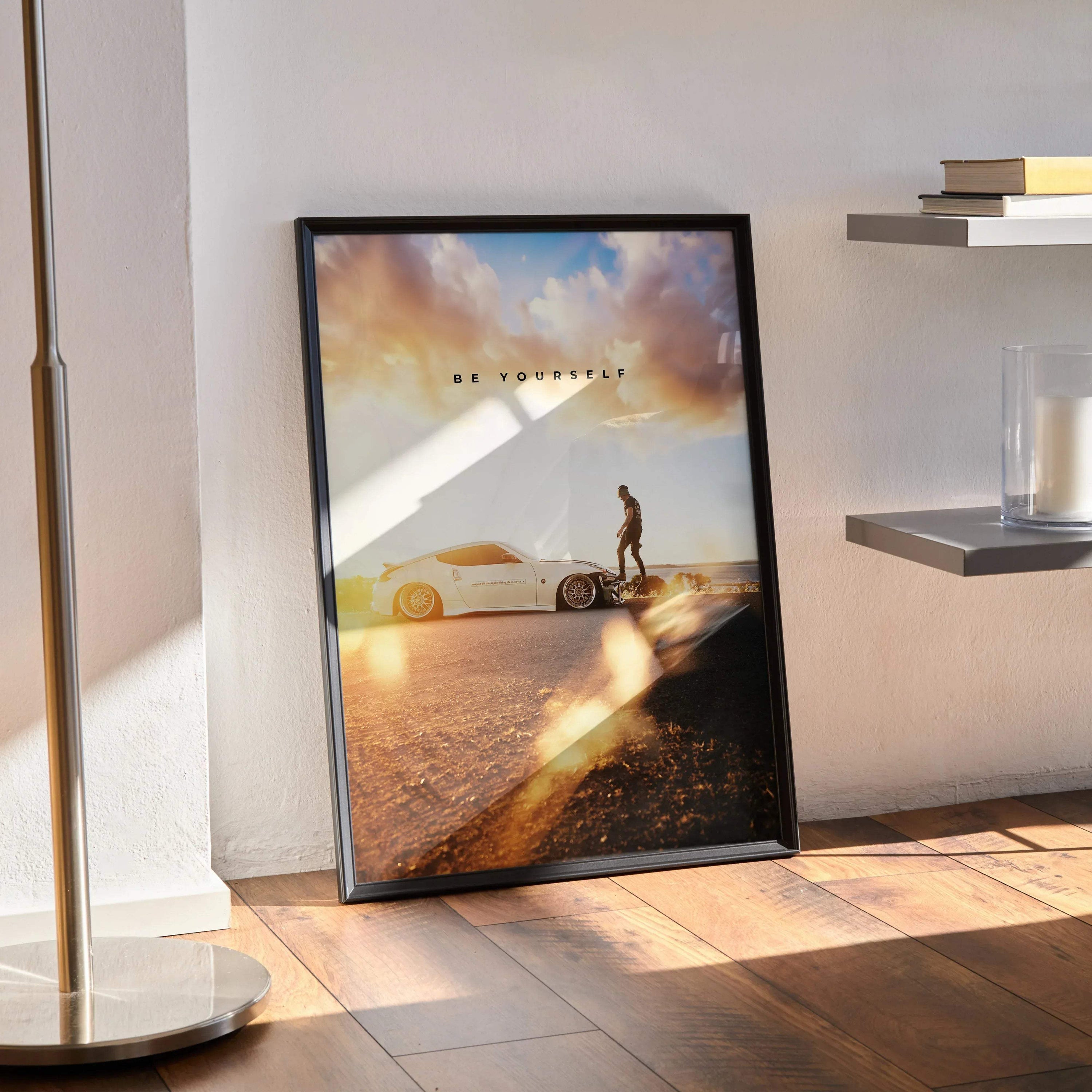 Nissan 370z motivational poster wall art with car and sunset background in black frame.