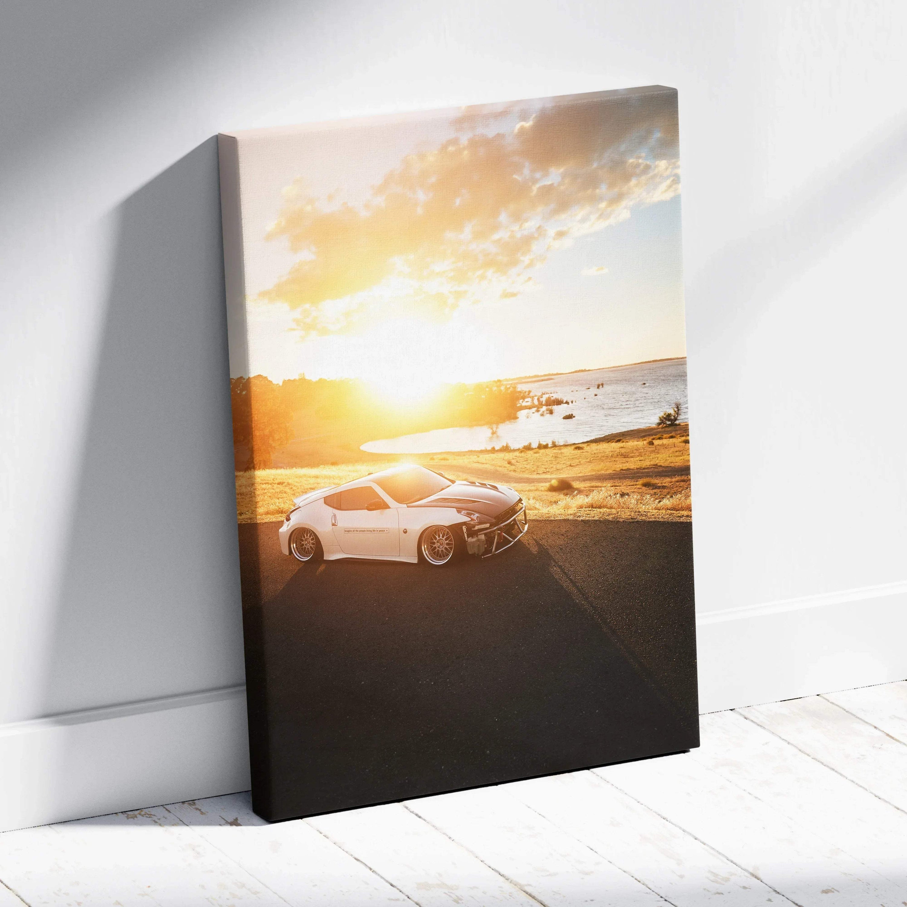 Nissan 370z white sports car at sunset canvas wall art with golden sky background.