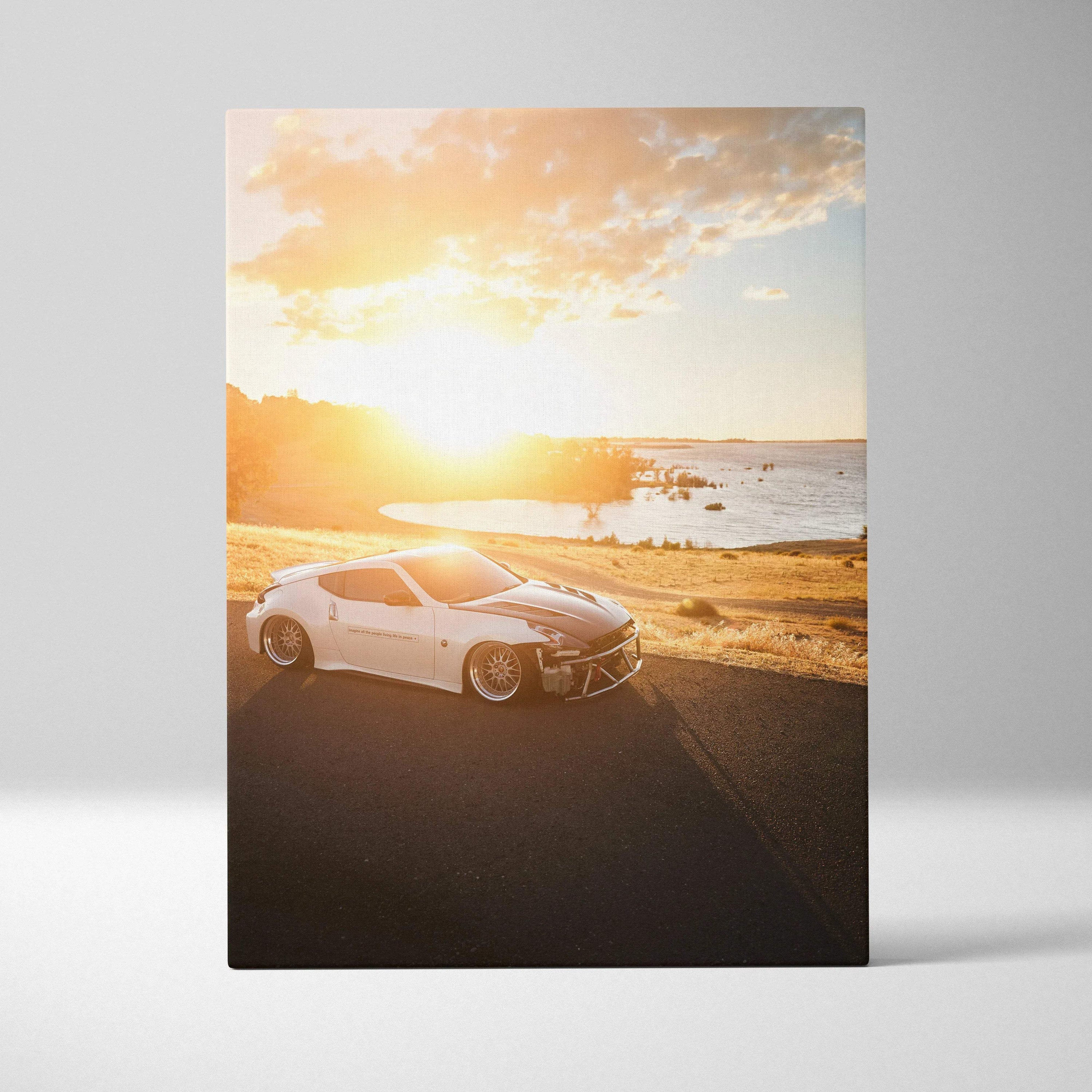 Nissan 370z sports car at sunset on vertical canvas wall art with warm golden light and coastal background.