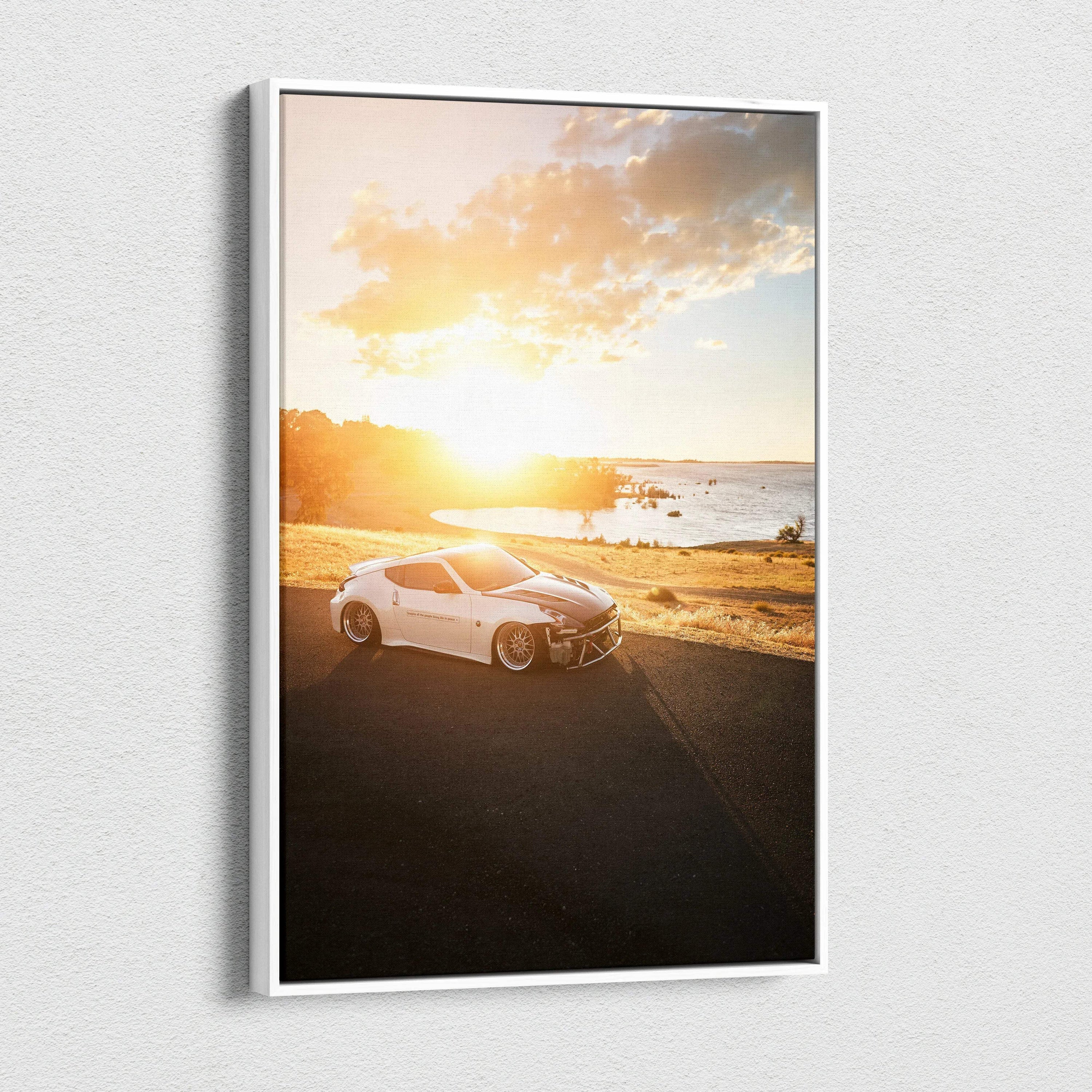 Vertical canvas art of a white Nissan 370z at sunset on a scenic beach road wall art.