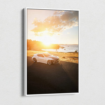 Vertical canvas art of a white Nissan 370z at sunset on a scenic beach road wall art.
