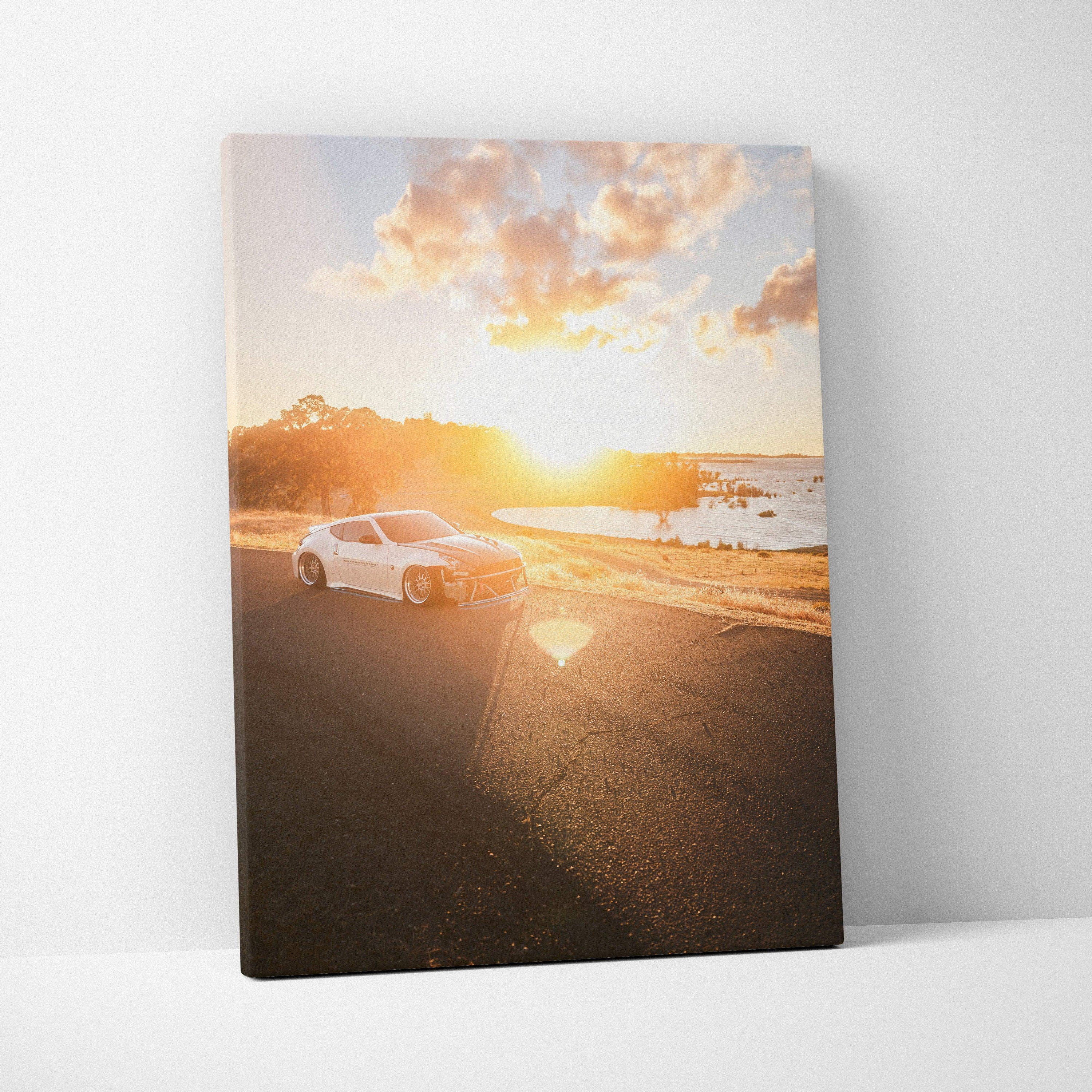 Nissan 370z driving on coastal road at sunset vertical canvas wall art.
