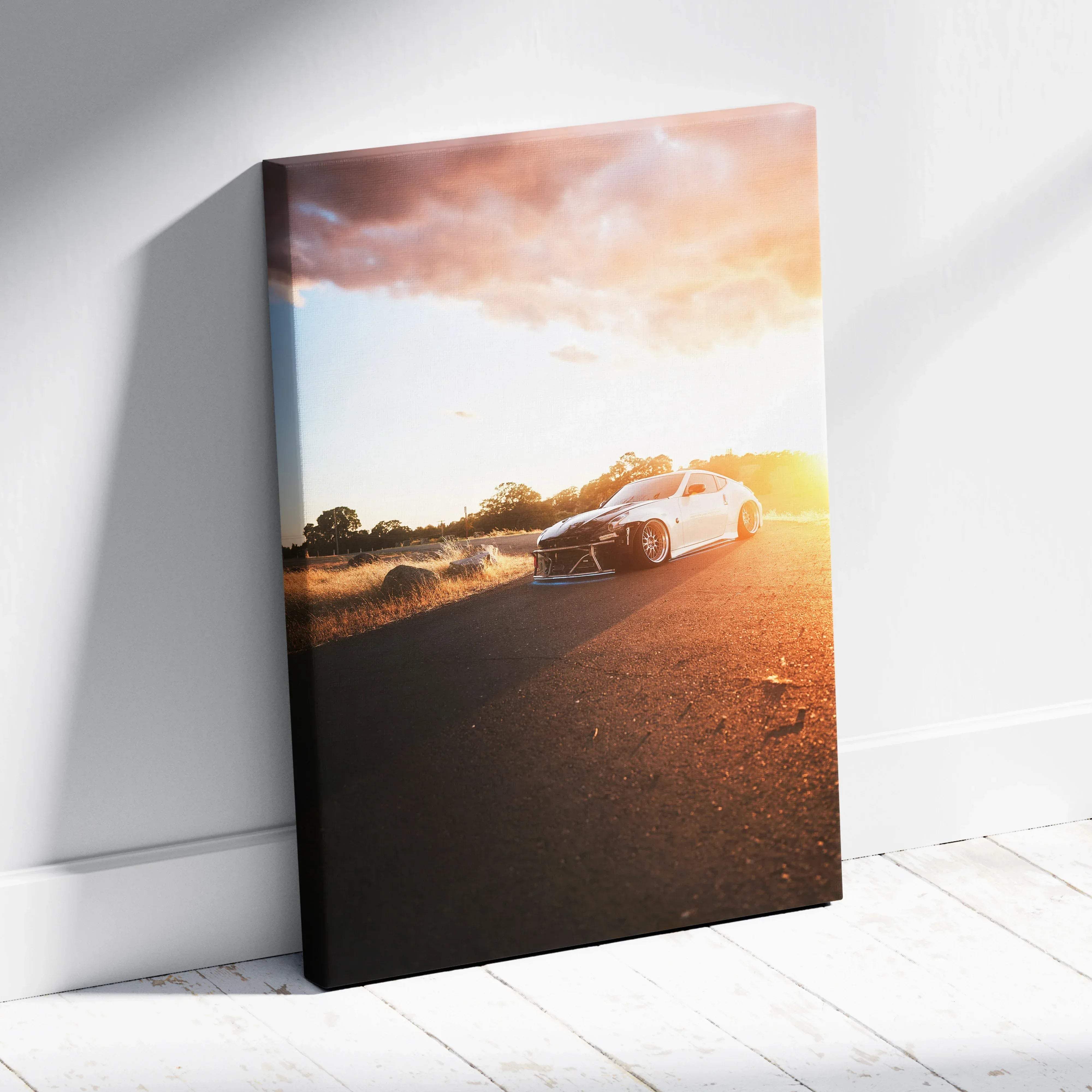 Canvas wall art featuring a white nissan 370z sports car with custom wheels under golden hour sunset lighting