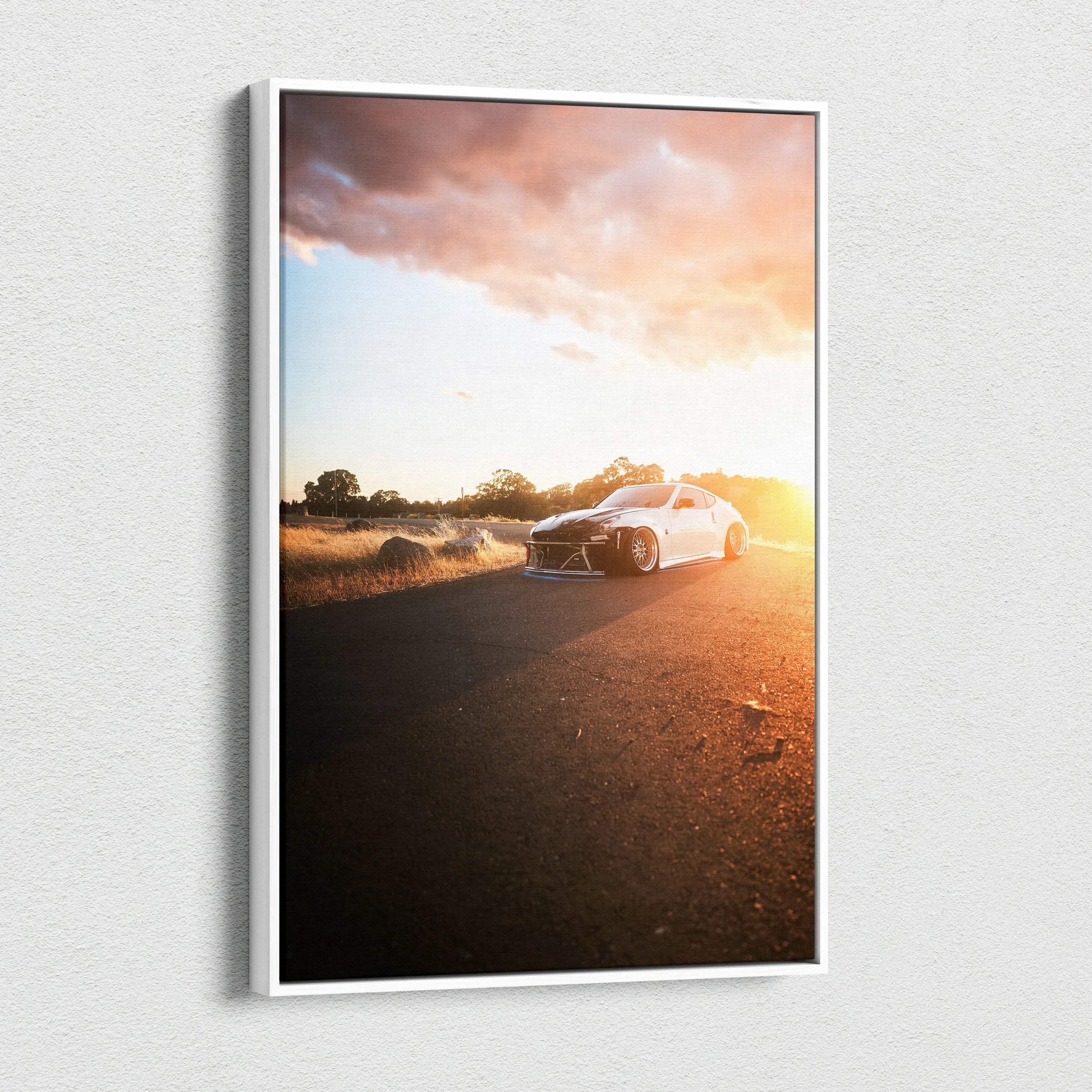 Sunset Nissan 370z driving on road high-resolution vertical canvas wall art.