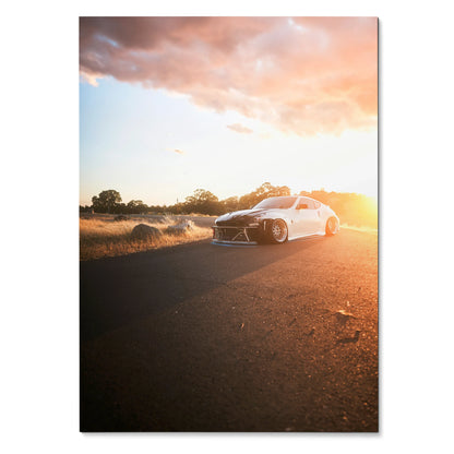 Nissan 370z car driving on road at sunset with warm sky poster wall art.