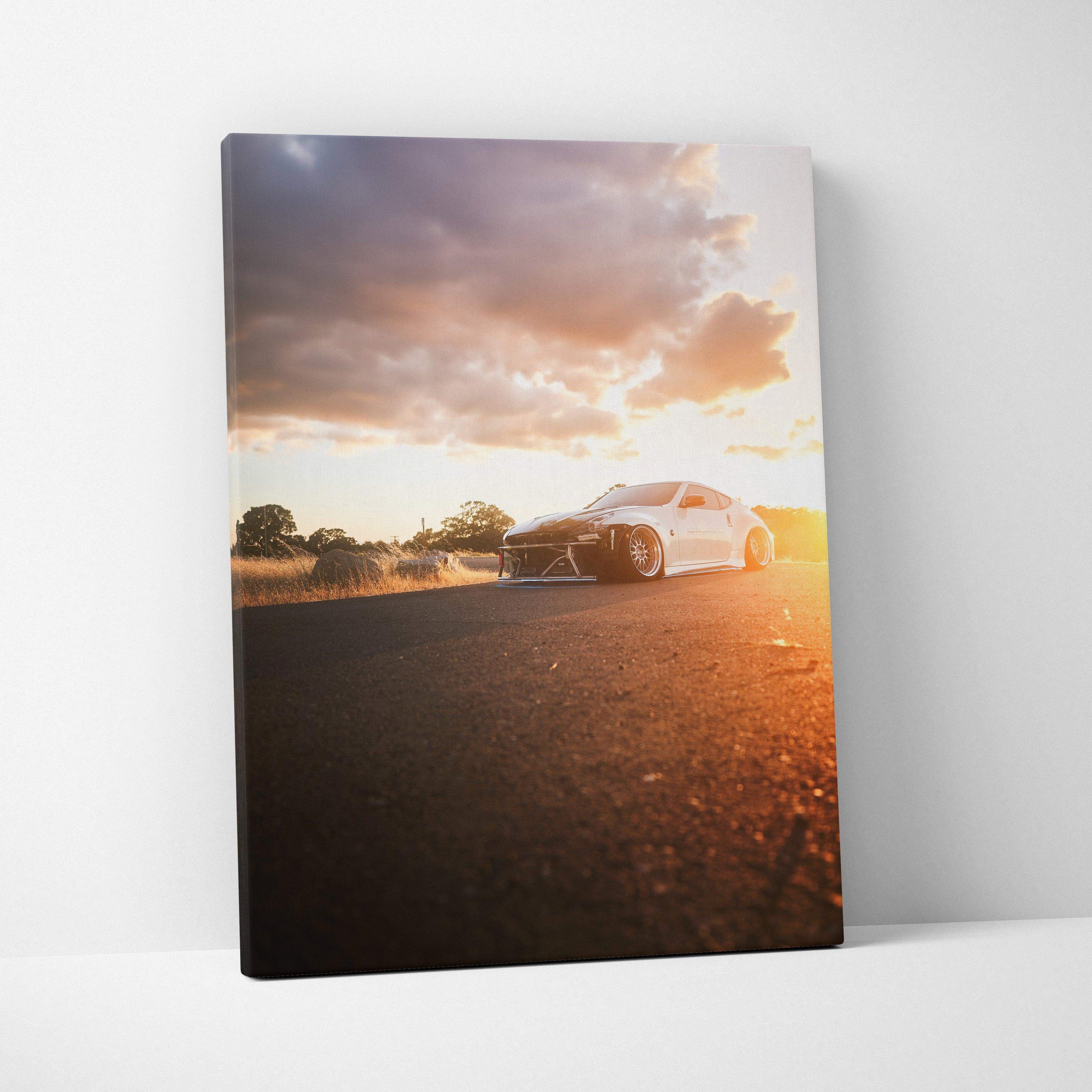 Nissan 370z at sunset vertical canvas wall art with warm orange sky and road details.