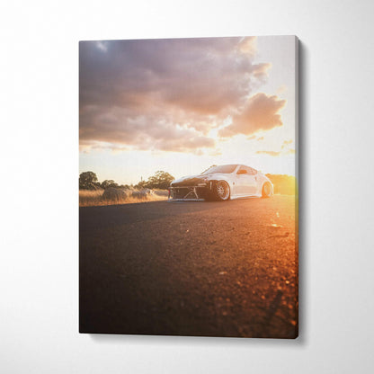 Nissan 370z parked on road at sunset with warm light on vertical canvas wall art.