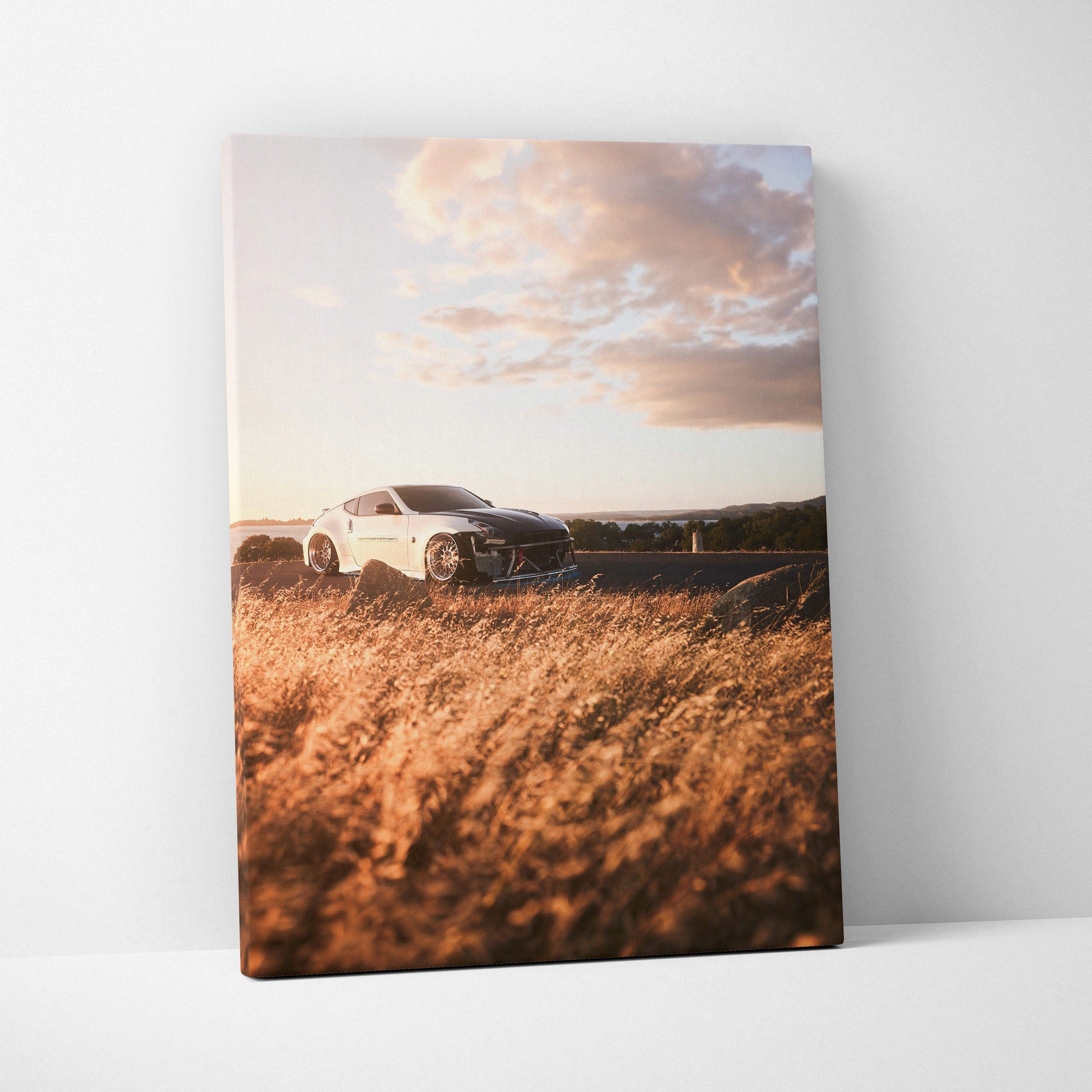 Nissan 370z on sunset road canvas wall art with golden grass and dramatic sky.